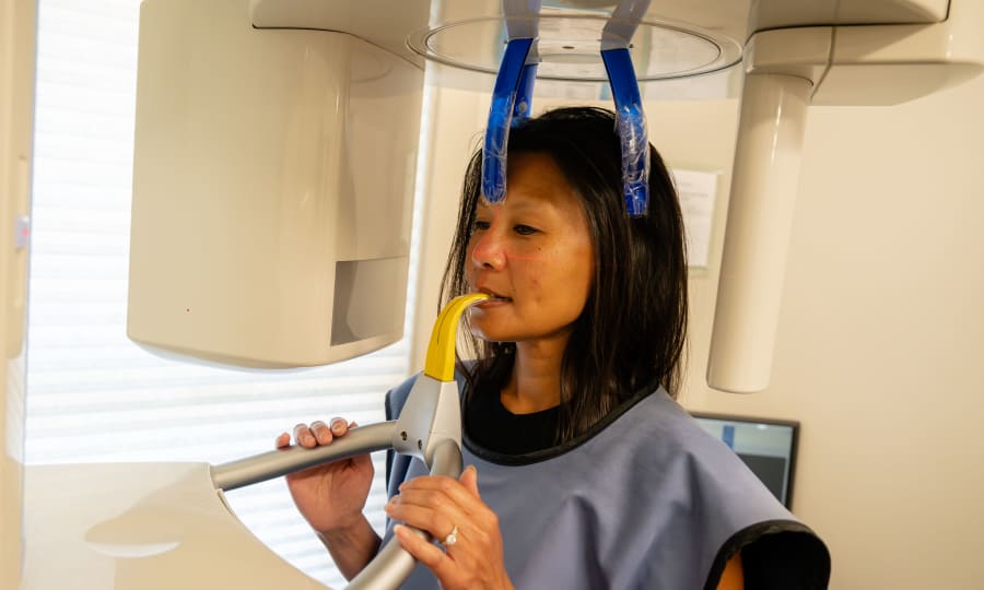 A patient at Sturbridge Orthodontics is getting a panoramic X-ray.